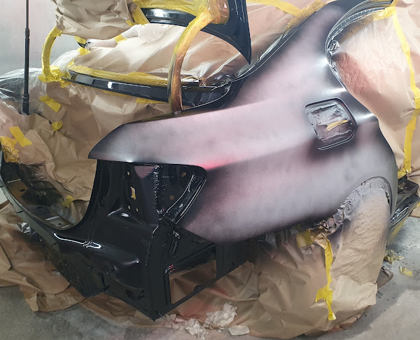 Body panel primed and prepped ahead of colour